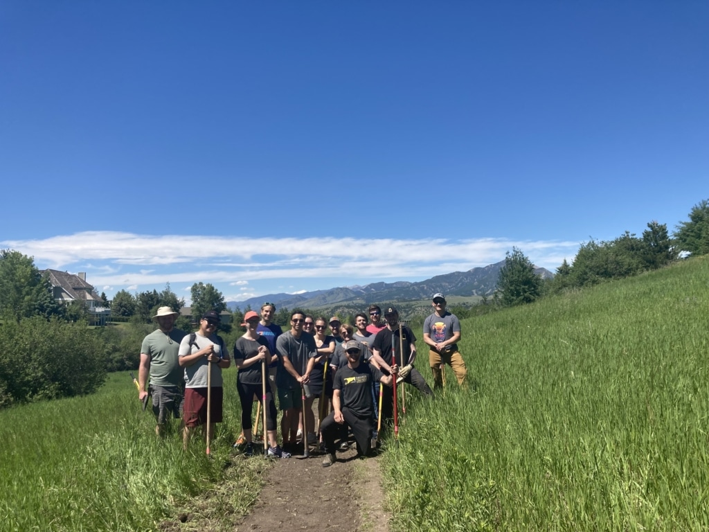 commonFont teammates enjoy company culture perk of company-sponsored volunteer days outside on the trail. 